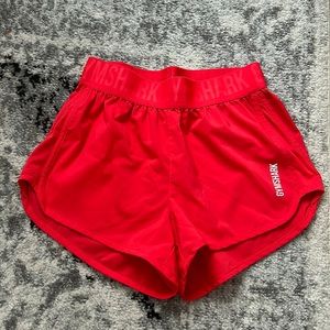 GYMSHARK Training loose fit shorts (pinky orange)